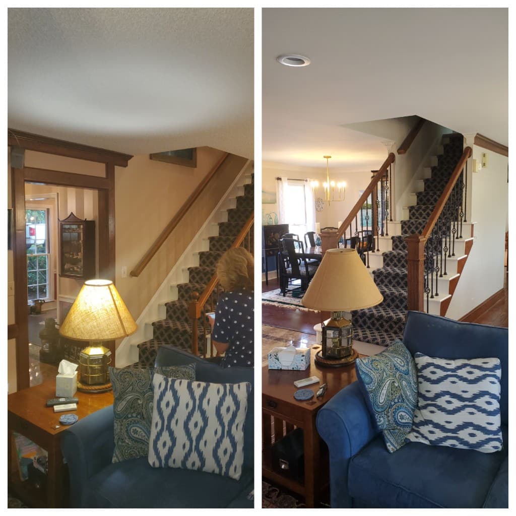 White screened-in porch with staircase and lattice skirting